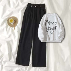 White Sweat Shirt Believe in Yourself with Black Wide Jeans